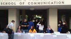 Registration table outside the Frances L Wolfson Building School of Communication at WordCamp Miami 2013.