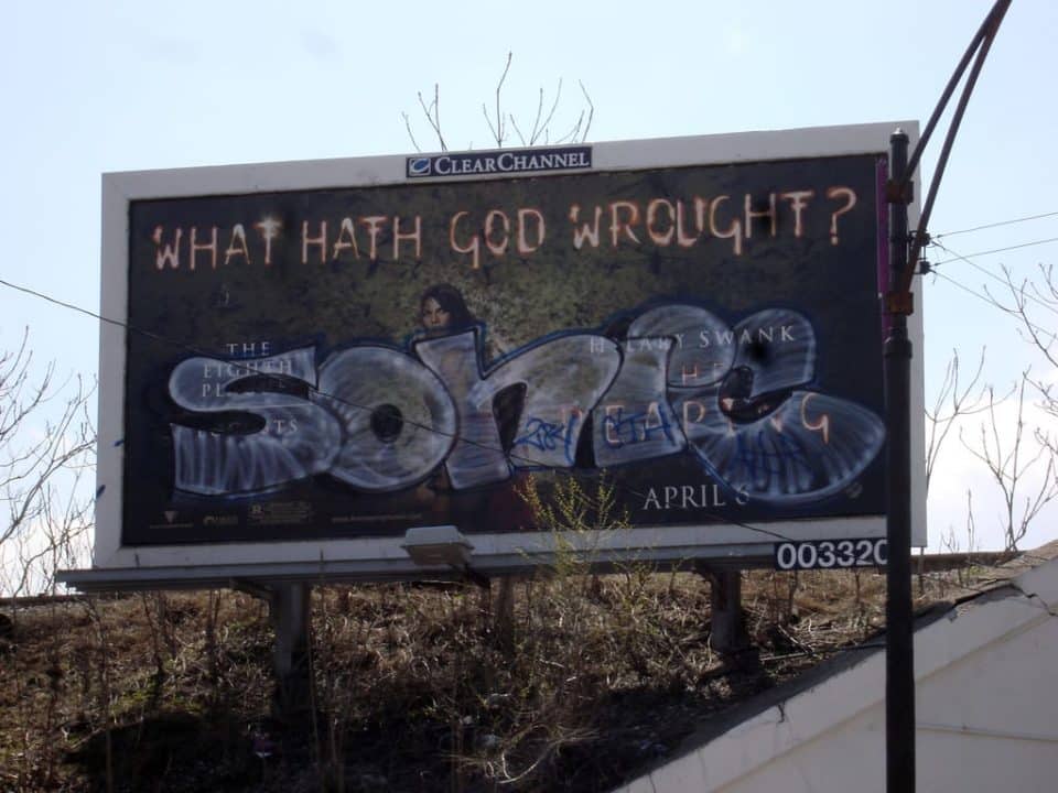 Billboard advertisement for "Swank" movie premiering April 5 with text "What Hath God Wrought?"