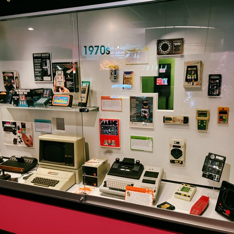 A display of video game consoles from the 1970s