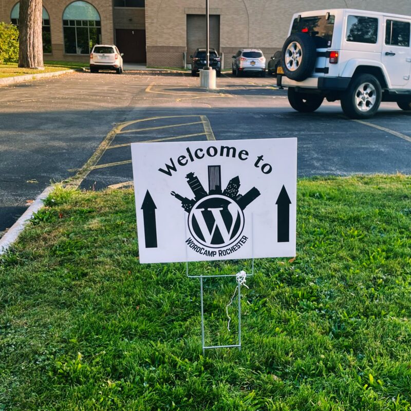 A sign that reads "Welcome to WordCamp Rochester"