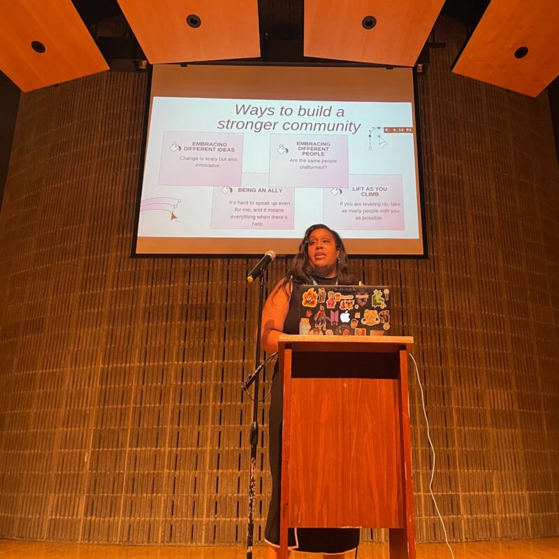 Nyasha Green giving a keynote at WordCamp Rochester, with the text "Ways to build a stronger community"