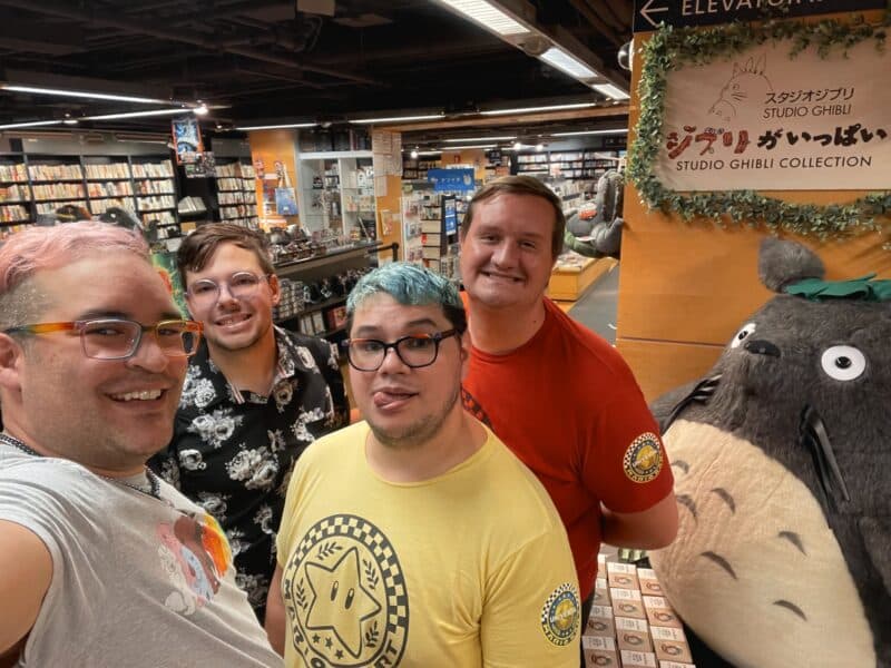 david and partners standing next to a large Totoro plush in Kinokuniya in NYC